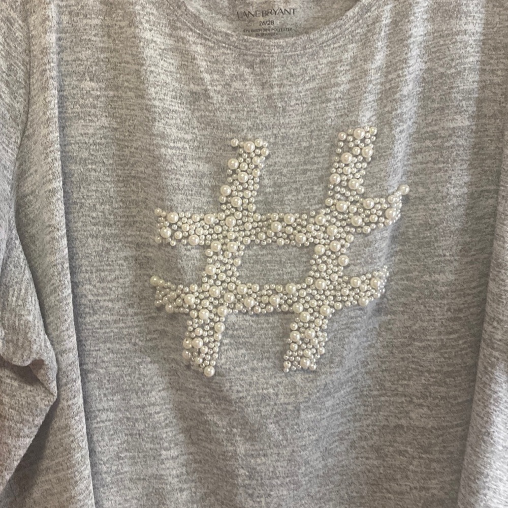 Gently used Lane Bryant short sleeve shirt with a hash tag symbol made of pearls